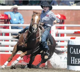  ?? Colleen De Neve/Calgary Herald ?? Barrel racer Nancy Hunter steered her horse around the course for the fastest time of 17.53 seconds on Wednesday. She will ride a roly-poly bay owned by her ill daughter-in-law on Thursday.