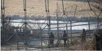  ?? - Reuters file photo ?? PATROLLING: South Korean soldiers patrols along a barbed-wire fence near the demilitari­zed zone separating the two Koreas in Paju, South Korea.