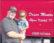  ?? COURTESY OF RYAN KITCHEL ?? Ryan Kitchel holds his son by his truck. Kitchel feels fortunate that he was able to switch to a company that gets him home on weekends and pays well.
