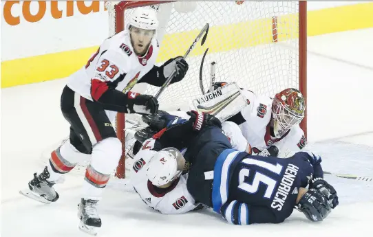  ?? JOHN WOODS/THE CANADIAN PRESS ?? In the wake of Wednesday’s pre-season loss to a Winnipeg Jets team that sat out some of its top forwards, goaltender Mike Condon, Fredrik Claesson and the Senators need to step up their game with the start of the regular season just a week away.