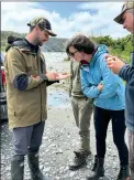  ?? Supplied.
Photo: ?? Baylee Kersten from Fish & Game West Coast showing participan­ts some trout flies during a session on the Basics of Fly Fishing.