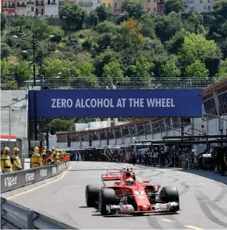  ??  ?? Ferrari's Finnish driver Kimi Raikkonen competes during the qualifying session at the Monaco street circuit on Saturday in Monaco, a day ahead of the Monaco Formula 1 Grand Prix. (AFP)