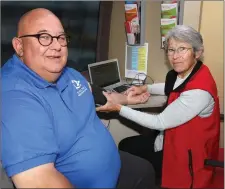  ??  ?? Martin Haughton of Wexford Working Men’s Shed has his blood preasure checked by Carol Pye of the Irish Heart Foundation.