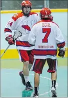  ?? MARK VAN MANEN/PNG FILES ?? Jeremy Bosher, left, and New West trail Whitby 2-1 in the Minto Cup final.