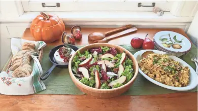  ?? MICHAEL SEARS, MILWAUKEE JOURNAL SENTINEL ?? Baked brie topped with cranberrie­s and pecans, a fall apple salad with candied pecans and a curried chicken salad with fruit and cashews make up a serve-yourself menu ideal for a holiday planning party.
