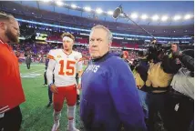  ?? MICHAEL DWYER / ASSOCIATED PRESS ?? New England head coach Bill Belichick, center, turns away after shaking hands with Kansas City quarterbac­k Patrick Mahomes following Sunday’s game in Foxborough, Mass.