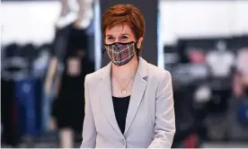  ?? Photograph: Jeff J Mitchell/AFP/Getty Images ?? Scotland’s first minister, Nicola Sturgeon, wears a Tartan face mask in Edinburgh.