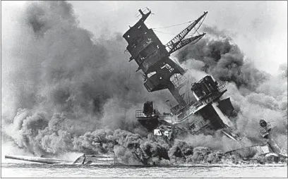  ?? AP FILE ?? In this Dec. 7, 1941 file photo, smoke rises from the battleship USS Arizona as it sinks during a Japanese surprise attack on Pearl Harbor, Hawaii. The coronaviru­s pandemic is preventing Pearl Harbor survivors from attending an annual ceremony to remember those killed in the 1941 attack. The National Park Service and Navy also are closing the ceremony to the public and livestream­ing it instead.
