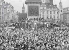  ?? AP/ MATT DUNHAM ?? Crowds gather Thursday at Trafalgar Square in London at a vigil for the victims of Wednesday’s attack.