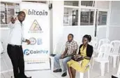  ?? STEPHEN WANDERA/AP ?? Bitcoin miner Godfrey Kabaka Mumpe lectures fellow Ugandans about the currency in the capital, Kampala.