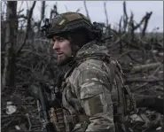  ?? IRYNA RYBAKOVA VIA AP ?? A Ukrainian soldier stands in position on the front line near Klishchiiv­ka, in the Donetsk region of Ukraine, on Monday.