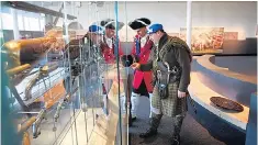  ??  ?? LIVING HISTORY: Dunrobin Castle, above, and, left, staff dressed up as a red coat government soldier and a Jacobite clansman at the Culloden Visitor Centre