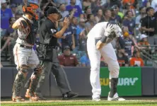  ?? Morry Gash / Associated Press ?? Milwaukee’s Jett Bandy reacts after Eduardo Nuñez saved the Giants by leaping to catch Bandy’s liner in the ninth.