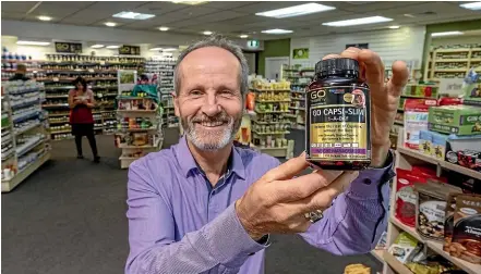  ??  ?? Marshall’s Health &amp; Natural Therapy store manager Brent Wilson has the new Go CapsiSlim capsules to help people meet their weight-loss goals.