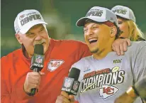  ?? MARK J. TERRILL/ASSOCIATED PRESS ?? Chiefs head coach Andy Reid, left, and quarterbac­k Patrick Mahomes speak during a television interview after defeating the 49ers in Super Bowl LIV on Sunday in Miami Gardens, Fla.