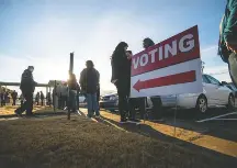  ?? Elijah Nouvelage for THE Washington Post ?? Voters line up in Georgia. The Electronic Registrati­on Informatio­n Center requires member states to share data with one another.