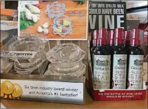  ??  ?? Chefs often give the garlic twist, left, as a gift because it’s proved so useful in their own kitchens, says Sharon O’Quinn of Faraday’s Kitchen Store. Red wine stain remover would make a good stocking stuffer.