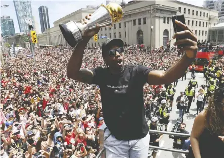  ?? Frank Gunn/THE CANADIAN PRESS ?? Kawhi Leonard celebrated a championsh­ip with the City of Toronto just a few short weeks ago, and now the whole city is holding its breath waiting to see if he will return to the Raptors.