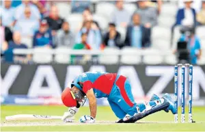  ??  ?? Dangerous game: Afghanista­n’s Hashmatull­ah Shahidi played on after a blow to the head at the World Cup; Australia’s Phillip Hughes (below) died after he was hit in 2014