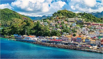  ?? ?? FOOD FOR THOUGHT: Grenada’s colourful capital of Saint George’s has a vibrant market and lively restaurant­s