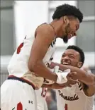  ?? Peter Diana/Post-Gazette ?? Chris Coalmon celebrates with Robert Morris teammate Jon Williams after scoring Thursday night.