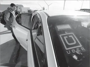  ?? Al Seib Los Angeles Times ?? PREVIOUSLY, venture capital firms stumbled over each other to invest in Uber, but the company has been hurt by a string of scandals. Above, Ronit Belson catches an UberX ride from LAX last year.