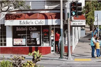  ?? Photos by Lea Suzuki/The Chronicle ?? A customer enters Eddie’s Cafe on Tuesday. The building in which the restaurant is located is for sale, and a Bay Area nonprofit eyeing the property is facing a lack of funds through a city program.