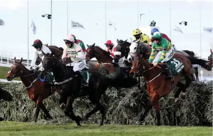  ?? David Davies/PA ?? Minella Times and jockey Rachael Blackmore, right, on their way to winning the Grand National