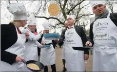  ?? PICTURE: EPA ?? MPs prepare for the annual parliament­ary pancake race at Victoria Gardens outside the Houses of Parliament in London, Britain, yesterday. MPs from the Lords, Commons and the media took part in the annual Shrove Tuesday pancake race to raise money for...