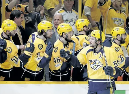  ?? MARK HUMPHREY/THE ASSOCIATED PRESS ?? Nashville Predators’ defenseman Roman Josi, of Switzerlan­d, is congratula­ted after scoring the go-ahead goal during the third period in Game 3 of the Western Conference final in the NHL hockey Stanley Cup playoffs, on Tuesday, in Nashville, Tenn. The...