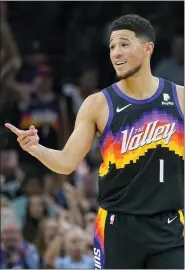  ?? MATT YORK — THE ASSOCIATED PRESS ?? Phoenix Suns guard Devin Booker (1) reacts to a play against the Dallas Mavericks during the second half of Game 1in the second round of the NBA Western Conference playoff series on Monday in Phoenix.