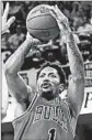  ?? TONY DEJAK/AP ?? The Bulls’ Derrick Rose rises up for a first-half jumper in Monday night’s Game 1 win. He scored 25 points.