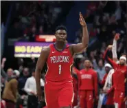  ?? GERALD HERBERT - THE ASSOCIATED PRESS ?? New Orleans Pelicans forward Zion Williamson (1) reacts after making a 3-point basket in the second half of a game against the San Antonio Spurs in New Orleans, Wednesday, Jan. 22, 2020. The Spurs won 121-117.