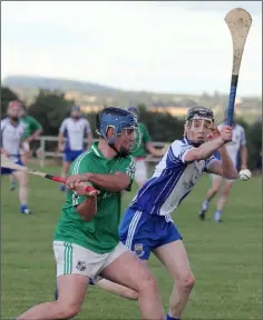  ??  ?? Tommy Walsh clears for St. James’ despite the blocking attempt by Craanford’s Jim Kenny.