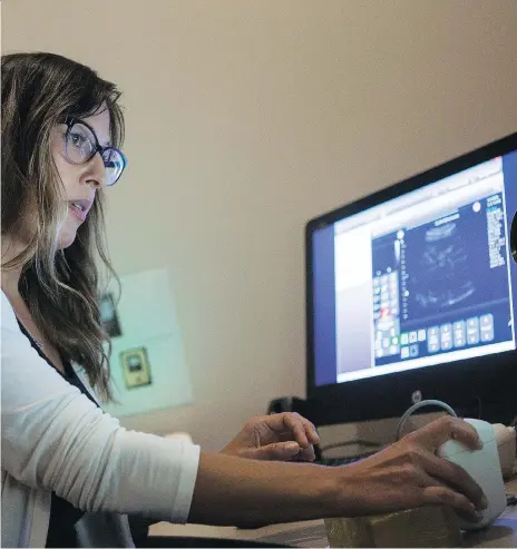  ?? KAYLE NEIS ?? Working from Saskatoon, sonographe­r Nadine Kanigan uses remote ultrasound technology to perform ultrasound scans on women in Stony Rapids and La Loche. The technology was originally developed for the European Space Agency for use on astronauts in orbit.