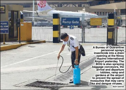  ?? RUDY SANTOS ?? A Bureau of Quarantine personnel sprays insecticid­e into a drain opening at the Ninoy Aquino Internatio­nal Airport yesterday. The BOQ is also spraying baggage conveyors, the arrival and departure lobbies, ramp and gardens at the airport to prevent the...