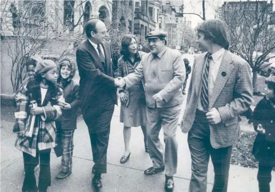  ??  ?? ABOVE: On his way to a polling place in 1974, Sen. Adlai E. Stevenson III is greeted by a well-wisher on North Dearborn. With the senator are his wife, Nancy, and son, Adlai IV (right).