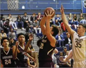  ?? DAVID M. JOHNSON - DJOHNSON@DIGITALFIR­STMEDIA.COM ?? Lansingbur­gh’s John Bessette gets an offensive rebound during a Colonial Council boys basketball game against Cohoes Dec. 1, 2017at Cohoes High School.