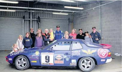  ??  ?? Racing driver Gavin Johnson had his Porsche signed with Runcorn school children’s good luck messages before his recent race at Anglesey.