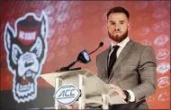  ?? NELL REDMOND — THE ASSOCIATED PRESS ?? North Carolina State quarterbac­k Devin Leary answers a question during ACC media days July 22in Charlotte, N.C.