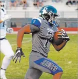  ?? JASON OGULNIK/ LAS VEGAS REVIEW-JOURNAL ?? Desert Pines’ Isaiah Morris runs for a touchdown during Friday’s 44-41 win over Centennial at Desert Pines. Morris rushed for 208 yards on 15 carries and had two touchdowns.