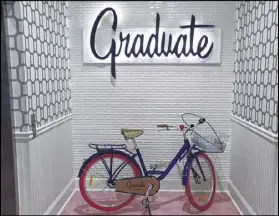  ??  ?? The Graduate’s bright, sleek lobby is adorned with plenty of artwork and other displays, like this vintage bike next to the elevators.