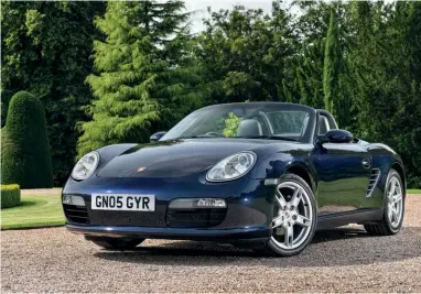  ?? ?? Above 987 Boxster looks great in Midnight Blue and provides plenty in the way of summer fun