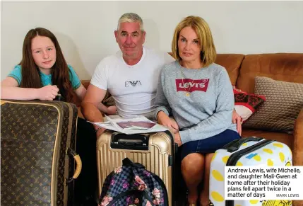  ?? MARK LEWIS ?? Andrew Lewis, wife Michelle, and daughter Mali-Gwen at home after their holiday plans fell apart twice in a matter of days