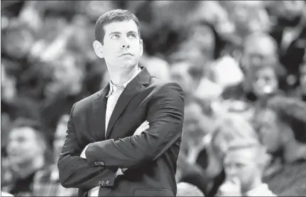  ?? ANDY LYONS/GETTY-AFP ?? Celtics coach Brad Stevens isn’t used to being away from the sidelines as the suspension of the NBA season has surpassed two weeks.
