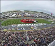  ?? MIKE MCCARN — THE ASSOCIATED PRESS FILE ?? In this file photo, the field takes the green flag to start the NASCAR Cup Series auto race at Charlotte Motor Speedway over the summer. Charlotte Motor Speedway gets a win for the buzz it created by taking a bulldozer to its infield and building something new to NASCAR. Charlotte’s ‘roval will debut Sunday in a critical playoff race that debuts a track unlike anything used before in NASCAR.