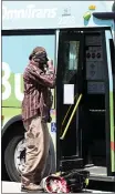  ?? WILL LESTER— STAFF PHOTOGRAPH­ER ?? A commuter in Montclair in April is asked to wear a face covering. Increasing numbers of COVID-19 infections and hospitaliz­ations are putting more of the country under guidelines issued by the CDC.