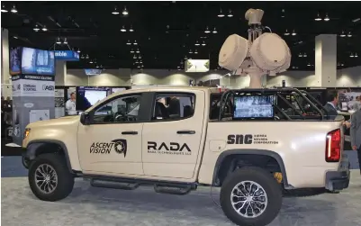  ??  ?? Ascent Vision’s mobile air defense system was exhibited at the 2018 Denver Xponential trade show and conference. Radar, optics, and electronic signal jamming can be deployed by this all-terrain vehicle traveling at 40mph on rough terrain. Note the RF signal emitter atop the off-roadtruck’s bed.
