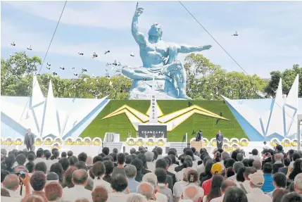  ?? AP ?? Doves fly around the Peace Memorial Statue during a ceremony at Peace Park in Nagasaki, southern Japan yesterday, marking the 73rd anniversar­y of the US atomic bombing on the city.