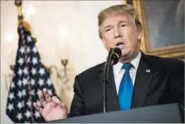  ?? DREW ANGERER/GETTY ?? President Donald Trump now says he wants Congress to toughen the Iran nuclear deal.